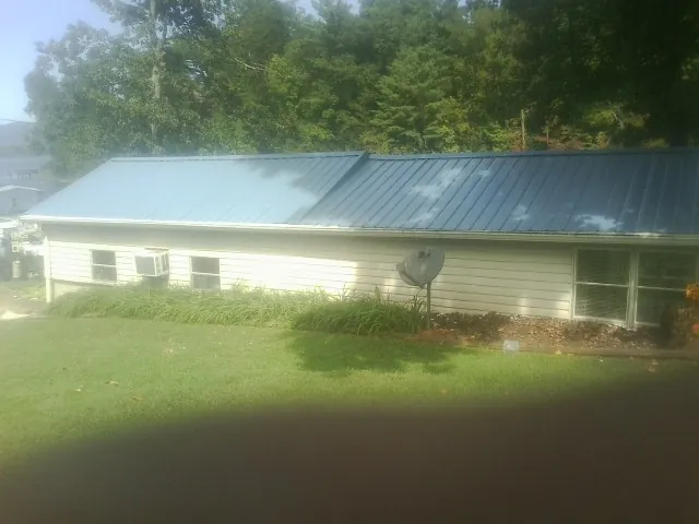 Blue metal roof running the length of a single story home in Manti